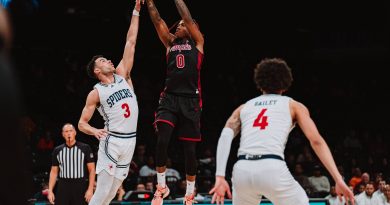Temple guard Khalif Battle pulls up for a jumper over the outstretched arms of a Richmond defender during Temple's loss to Richmond in the Empire Classic.