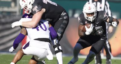 Ed Saydee (right) cuts through a hole in the line provided by Adam Klein (left).