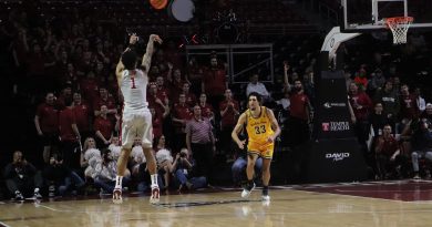 Damian Dunn shoots a three from the left elbow over a Wichita State defender.