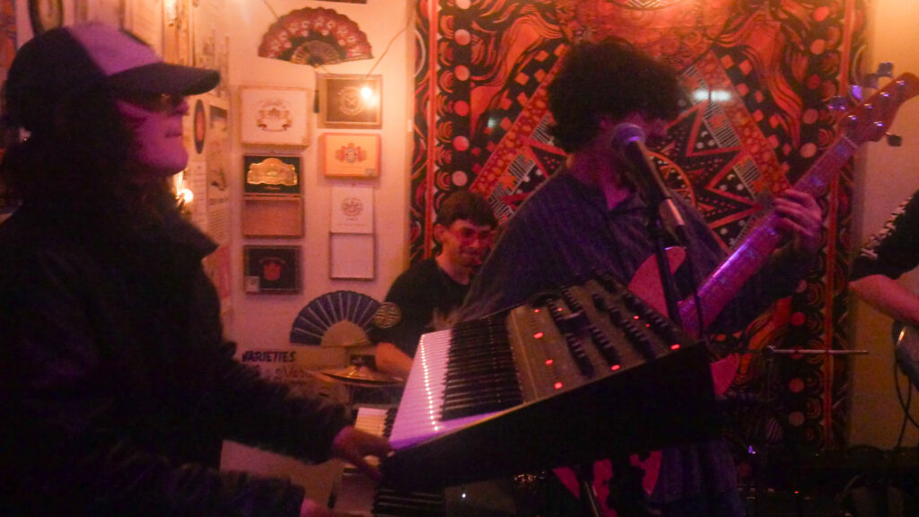Three members of Paratopia during a live session.