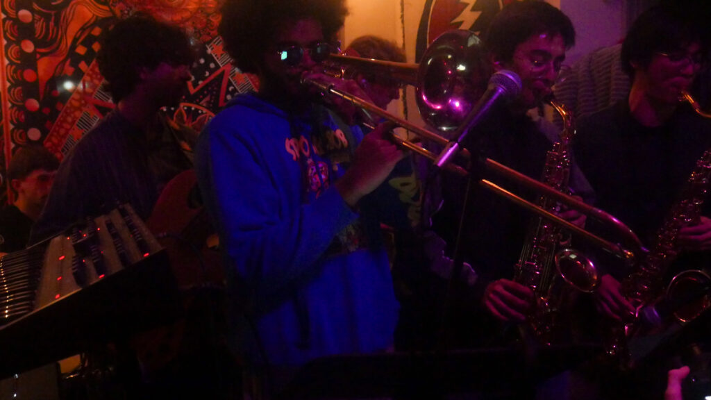 Paratopia's trombonist and two saxophone players during a live session.