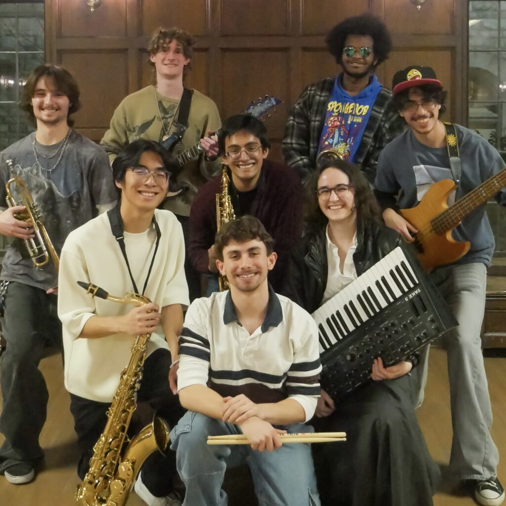 All Paratopia members posing with their instruments.